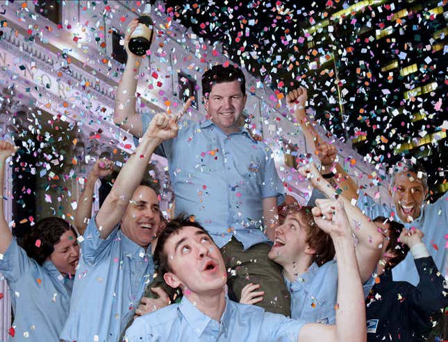 Joyous postal workers congratulate themselves on another job well done.