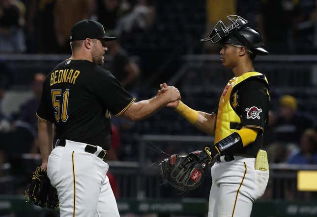 Aug 22, 2023; Pittsburgh, Pennsylvania, USA; Pittsburgh Pirates relief pitcher David Bednar (51) and catcher Endy Rodriguez (25) celebrate after defeating the St. Louis Cardinals at PNC Park. The Pirates won 6-3.