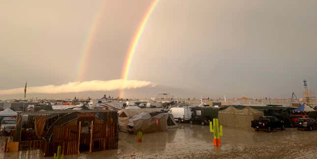 A rainbow seen over the muddy grounds of the “Burning Man” festival. 