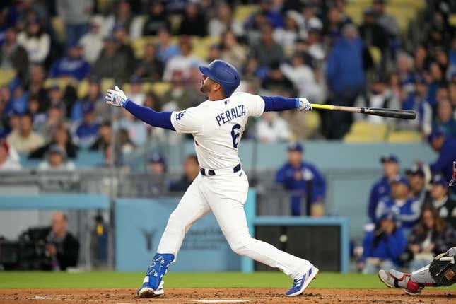 May 1, 2023; Los Angeles, California, USA; Los Angeles Dodgers left fielder David Peralta (6) hits a home run in the second inning against the Philadelphia Phillies at Dodger Stadium.