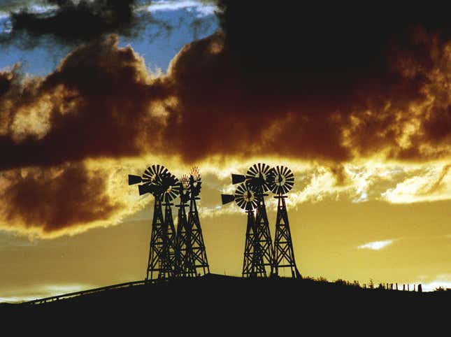 Clouds gather above windmills Friday, Aug. 1, 1997, at sunset on Watson’s Ranch, a few miles north of Scottsbluff, Ne.