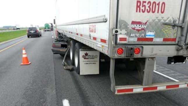 Image for article titled Mustang Driver Somehow Uninjured After Getting Wedged Under Semi, Dragged