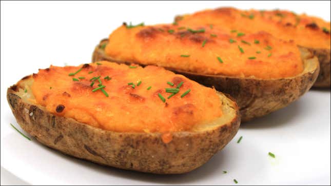 Ultra-Deluxe Twice-Baked Potatoes on white surface