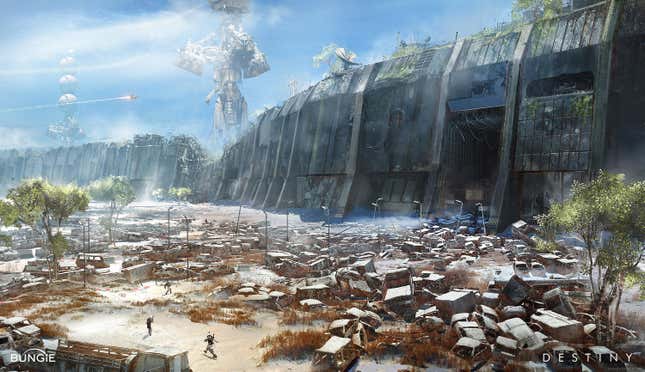 A junkyard of abandoned cars sits outside a giant concrete wall.