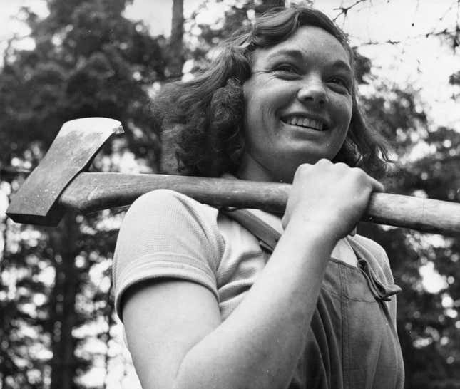 1942: Miss Cicely Clark of The Women’s Timber Corps at work in a timber camp in Suffolk as part of the war effort.