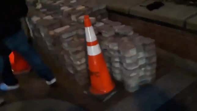 Image for article titled White House Propaganda Video Falsely Claims 'Domestic Terrorists' Planted Bricks for Protesters