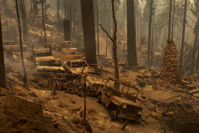 A community of forest homes lies in ruins along Auberry Road in the Meadow Lakes area after the Creek Fire swept through on Sept. 8, 2020, near Shaver Lake, California.