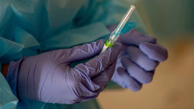 A flu vaccine being prepared in Las Rozas, Spain on Oct. 14, 2020.