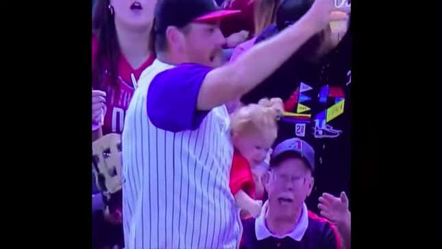 Dad With Baby Strapped To Chest Holding Beer Catches Foul Ball At