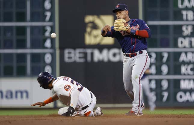 Aug 23, 2022; Houston, Texas, USA; Houston Astros shortstop Jeremy Pena (3) is out at second base as Minnesota Twins second baseman Jorge Polanco (11) throws to first base during the eighth inning at Minute Maid Park.