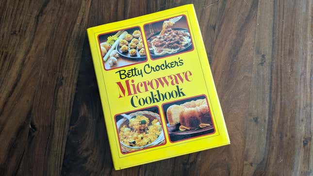 Copy of Betty Crocker's Microwave Cookbook, 1981 edition, sitting on wooden table