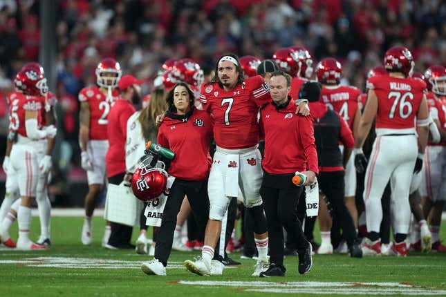 Jan 2, 2023; Pasadena, California, USA; Utah Utes quarterback Cameron Rising (7) walks with assistance off the field in the second half against the Penn State Nittany Lions of the 109th Rose Bowl game at the Rose Bowl.