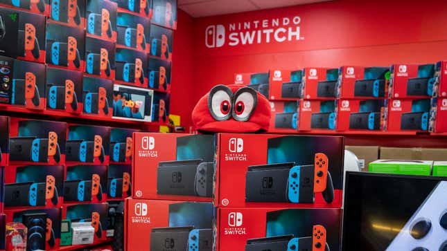 Nintendo Switch boxes clutter the sales floor in a gaming store.