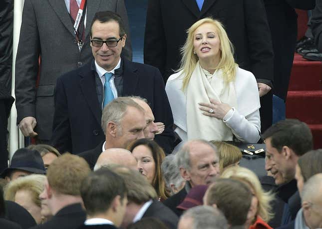Steven Mnuchin and his wife Louise Linton are greeted upon arrival on the platform of the US Capitol in Washington, DC, on January 20, 2017.