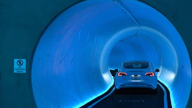 A Tesla car drives through a tunnel in the Central Station during a media preview of the Las Vegas Convention Center Loop on April 9, 2021 in Las Vegas, Nevada