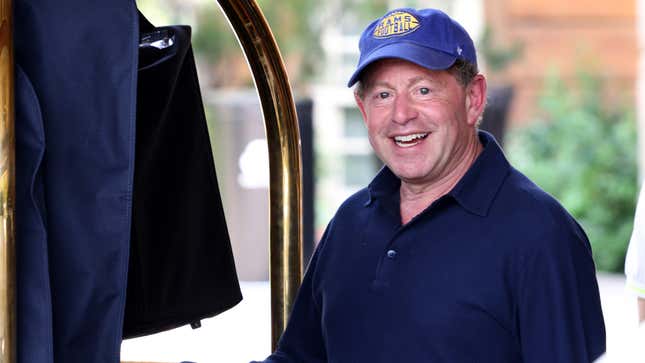 An older man wearing a "Rams Football" cap smiles at the camera.