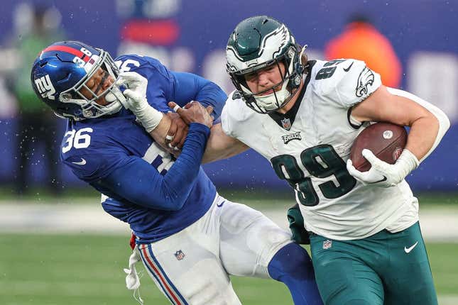 Dec 11, 2022; East Rutherford, New Jersey, USA; Philadelphia Eagles tight end Jack Stoll (89) fights off a tackle by New York Giants safety Tony Jefferson (36) during the second half at MetLife Stadium.