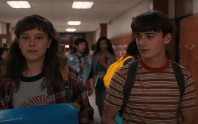 Eleven and Will walk in their high school hallway