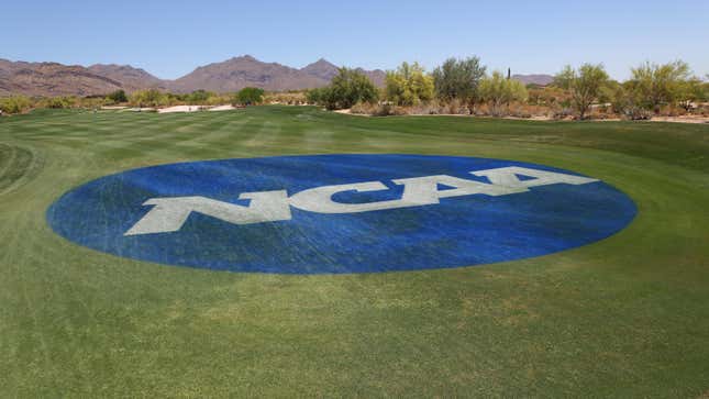 A blue circle surrounds the letters "NCAA" on a green grass field. In the distance, we see trees and mountains.