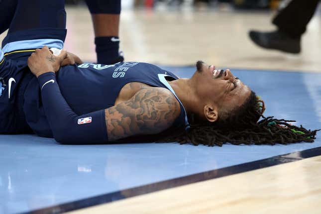 Apr 16, 2023; Memphis, Tennessee, USA; Memphis Grizzlies guard Ja Morant (12)reacts after falling to the ground during the second half during game one of the 2023 NBA playoffs against the Los Angeles Lakers at FedExForum.