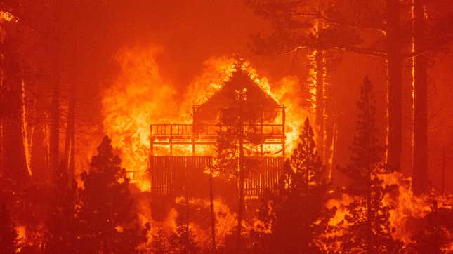 Flames consume multiple homes as the Caldor fire pushes into South Lake Tahoe, California on August 30, 2021. 