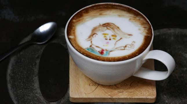 A cup of coffee with latte art in the image of Donald Trump