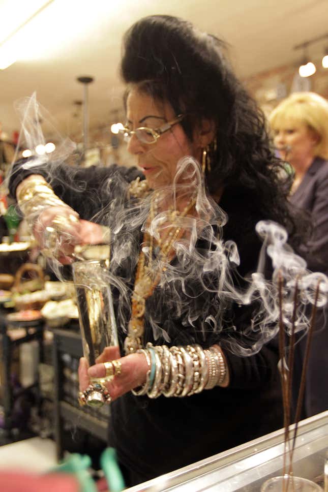 Lori Bruno demonstrates a shop blessing for the Herald at Hex, a witch shop, in Salem in 2011.