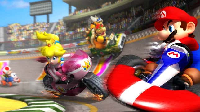 Mario and Princess Peach and Bowser ride go-karts on a race track.