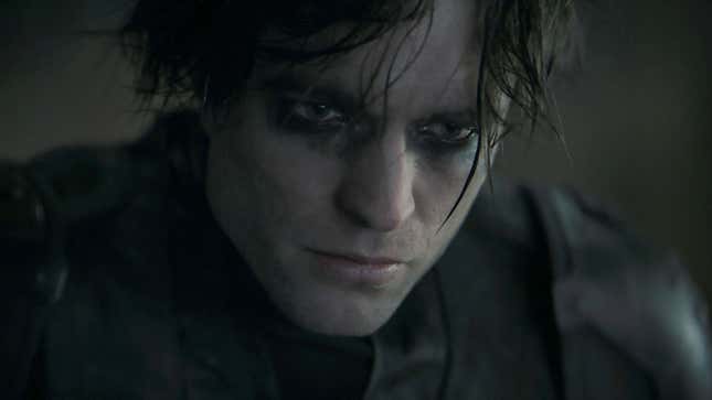 Robert Pattinson as Batman in The Batman, in costume and sans mask. 