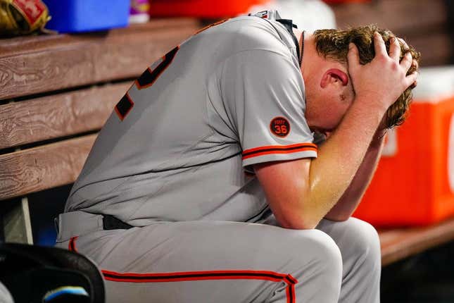 Apr 17, 2023; Miami, Florida, USA; San Francisco Giants starting pitcher Logan Webb (62) sits in the dug out after giving up a two-run home run against the Miami Marlins during the seventh inning at loanDepot Park.