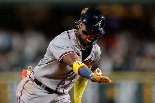 Aug 28, 2023; Denver, Colorado, USA; Atlanta Braves right fielder Ronald Acuna Jr. (13) gestures as he rounds the bases on a two run home run in the fifth inning against the Colorado Rockies at Coors Field.