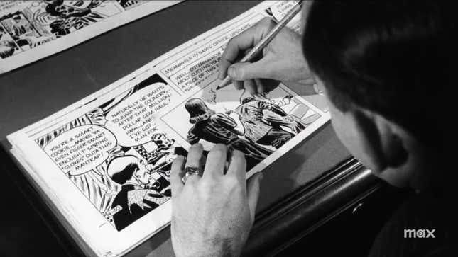 A black-and-white still of someone drawing a comic strip.
