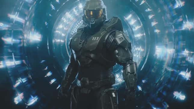 Master Chief stands in front of a big blue thing in the Halo TV show.