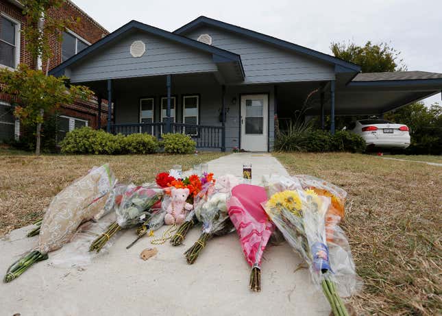 In this Monday, Oct. 14, 2019 photo, flowers lie on the sidewalk in front of the house in Fort Worth, Texas, where a white Fort Worth police officer Aaron Dean shot and killed Atatiana Jefferson, a black woman, through a back window of her home. Dean was not heard identifying himself as police on the bodycam video, and Interim Police Chief Ed Kraus has said there was no sign Dean or the other officer who responded even knocked on the front door. Dean resigned before being charged with murder. 
