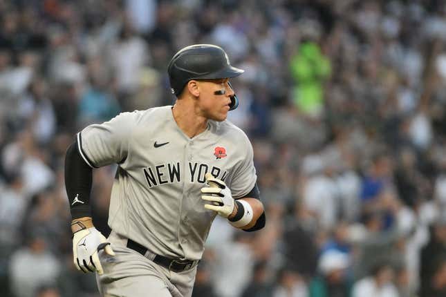 May 29, 2023;  Seattle, Washington, USA;  New York Yankees right fielder Aaron Judge (99) runs toward first base after hitting the ball against the Seattle Mariners at T-Mobile Park.