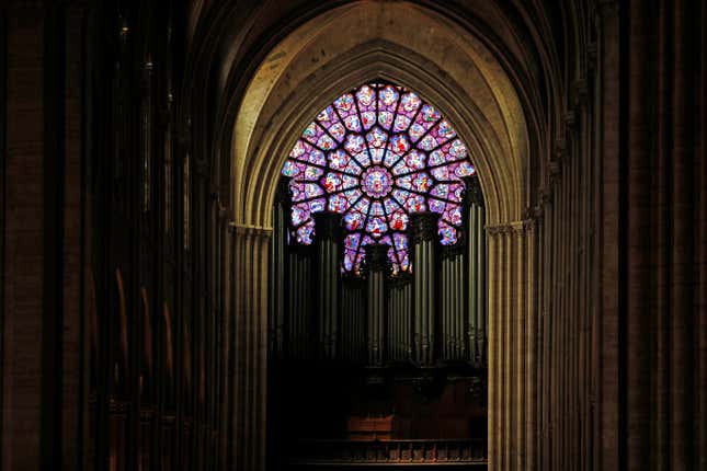 A view shows the organ and a rose window inside the Notre Dame Cathedral in Paris, France