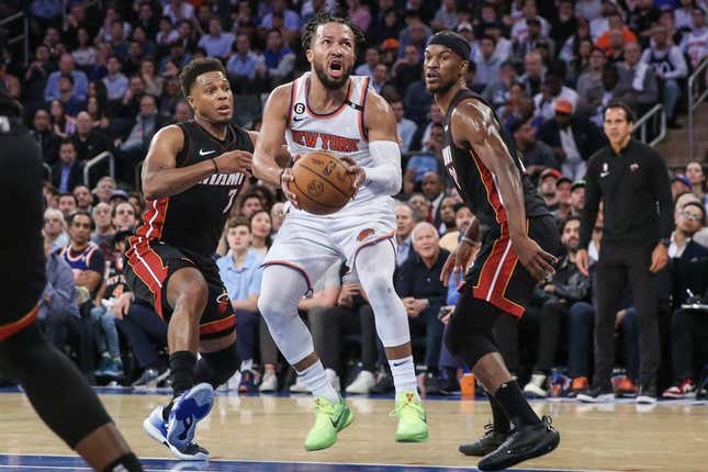 May 10, 2023; New York, New York, USA; New York Knicks guard Jalen Brunson (11) drives past Miami Heat guard Kyle Lowry (7) and forward Jimmy Butler (22) during game five of the 2023 NBA playoffs at Madison Square Garden.