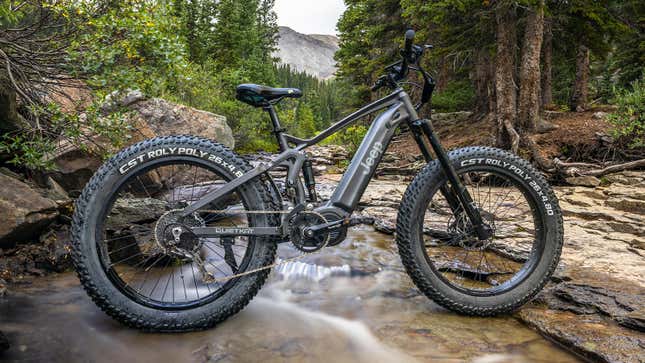 A photo of a Jeep E-bike in a river. 