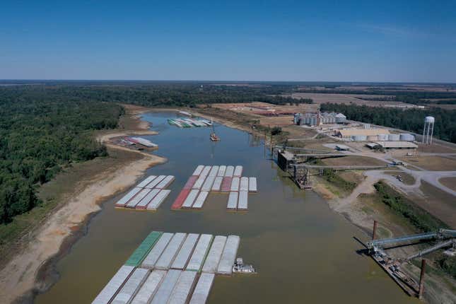 In this aerial view, barges, stranded by low water sit at the Port of Rosedale along the Mississippi River on October 20, 2022 in Rosedale, Mississippi.