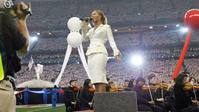 Beyonce Knowles sings the National Anthem prior to the start of Super Bowl XXXVIII on February 1, 2004 in Houston, Texas.