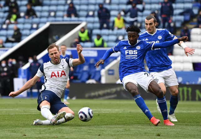 Harry Kane of Tottenham Hotspur fires in a shot past Wilfred Ndidi of Leicester City during the Premier League match between Leicester City and Tottenham Hotspur.
