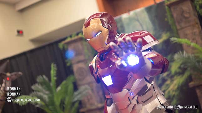 A cosplayer shows off glowing Iron Man cosplay at Fan Expo Canada. 