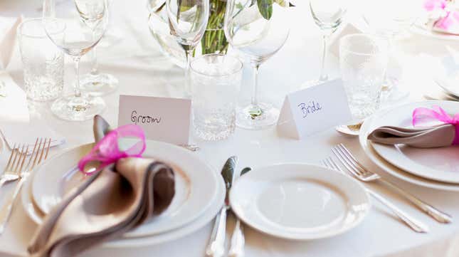 place settings for groom and bride at wedding reception