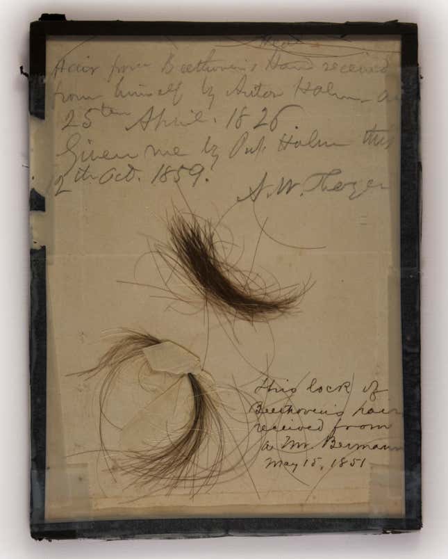 The two locks of hair, with inscriptions discussing their acquisition.