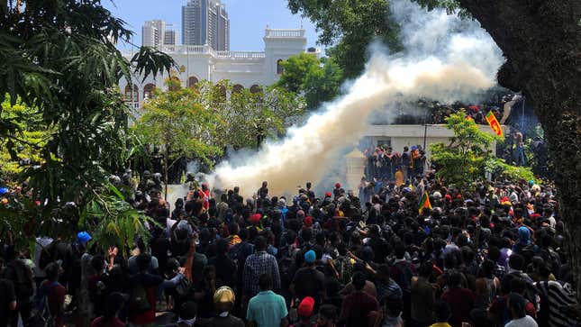 Demonstrators gather outside the office of Sri Lanka’s Prime Minister Ranil Wickremesinghe, amid the country’s economic crisis, in Colombo, Sri Lanka July 13, 2022. REUTERS/Adnan Abidi REFILE -QUALITY REPEAT