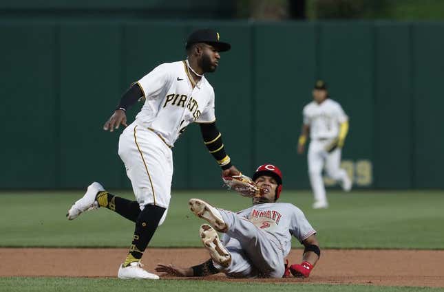 Apr 22, 2023; Pittsburgh, Pennsylvania, USA;  Cincinnati Reds  center fielder Jose Barrero (2) is tagged out between first and second base by Pittsburgh Pirates second baseman Rodolfo Castro (14) as Barrero attempts to steal second base during the fourth inning at PNC Park.