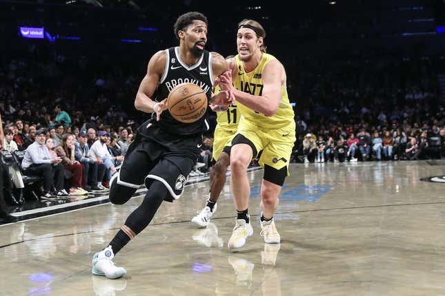 Apr 2, 2023; Brooklyn, New York, USA;  Brooklyn Nets guard Spencer Dinwiddie (26) looks to drive past Utah Jazz forward Kelly Olynyk (41) in the second quarter at Barclays Center.