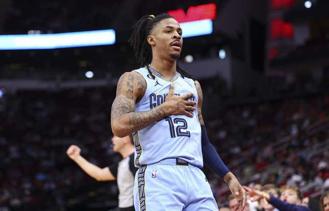 Mar 1, 2023; Houston, Texas, USA; Memphis Grizzlies guard Ja Morant (12) reacts after scoring a basket during the first quarter against the Houston Rockets at Toyota Center.