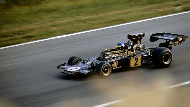 A photo of a black and gold Lotus Formula 1 car. 