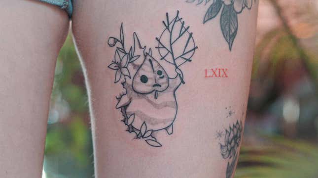 A person with a Korok tattoo poses for a photograph.